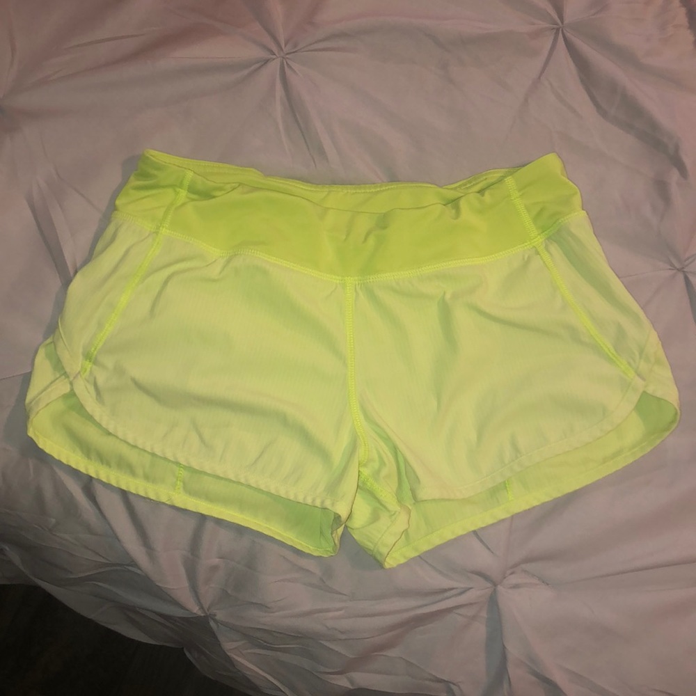 size 14 ivivva speed shorts; neon yellow